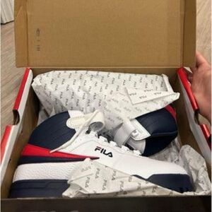 Brand New Fila Sneakers 
Men’s size 8.5 
Or can fit women’s 7/7.5. New in box